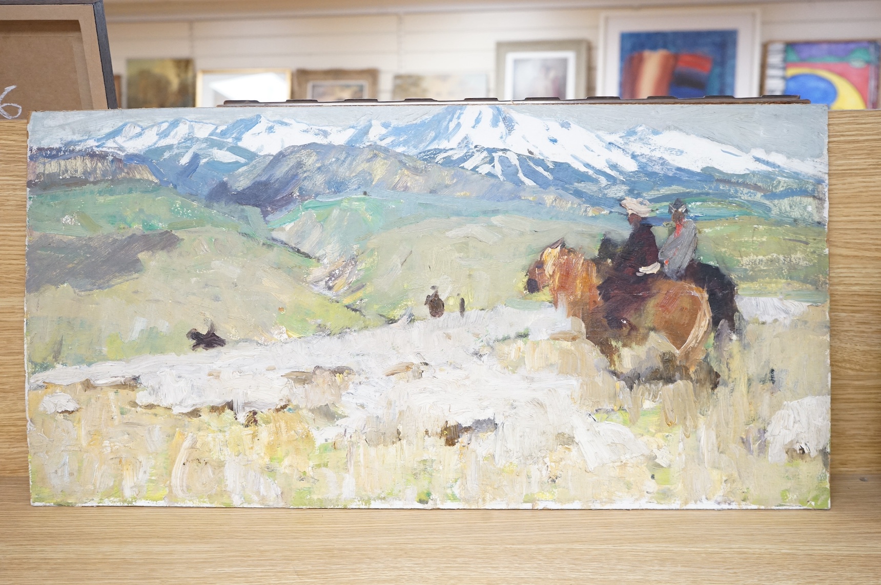 Russian School, impasto oil on board, Mountainous landscape with figures on horseback, unframed, inscribed verso, 36 x 69cm. Condition - fair